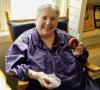 Joan Drury enjoys a treat at her beloved bookstore. Photo courtesy of Drury Lane Books